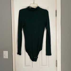 Long sleeve one piece with snaps, mock turtleneck